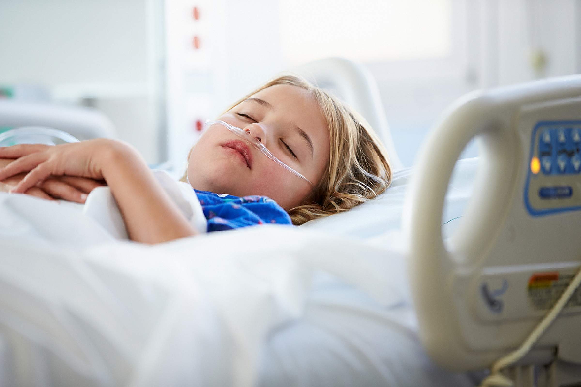 Young Child Sleeping In Intensive Care Unit